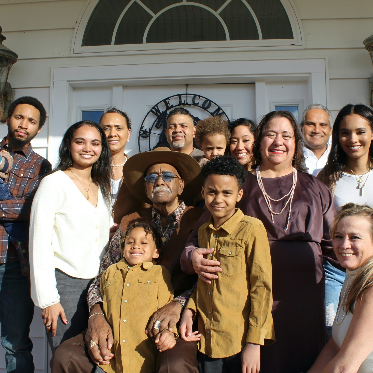 Small picture of a family standing in front of their home